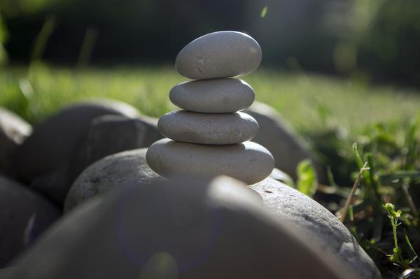 Harmony and balance - zen sculpture of white pebbles in a single tower