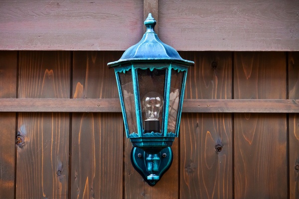 Lamp on a Wood Fence