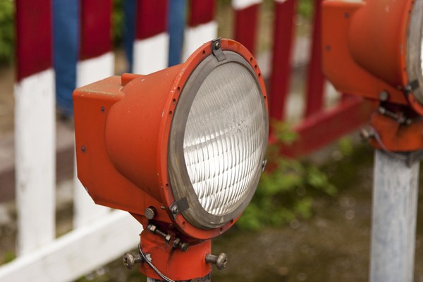 Red old street lamp in a garden