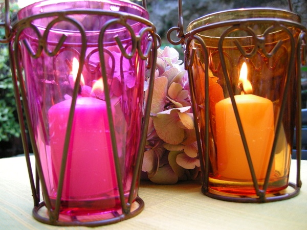 Ambiance candle lanterns lit in coloured glass lanterns