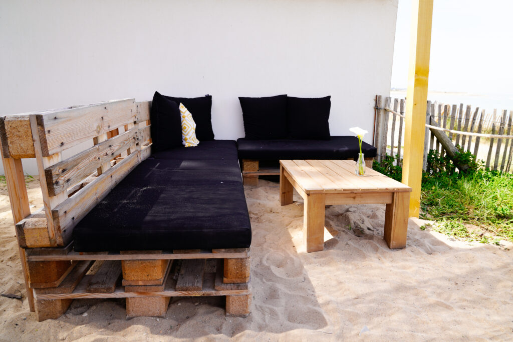 A garden recycled wood table bench made from old wooden storage pallet