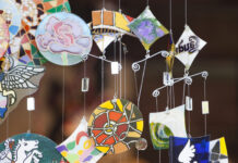 Colourful glass wind chimes hanging outside