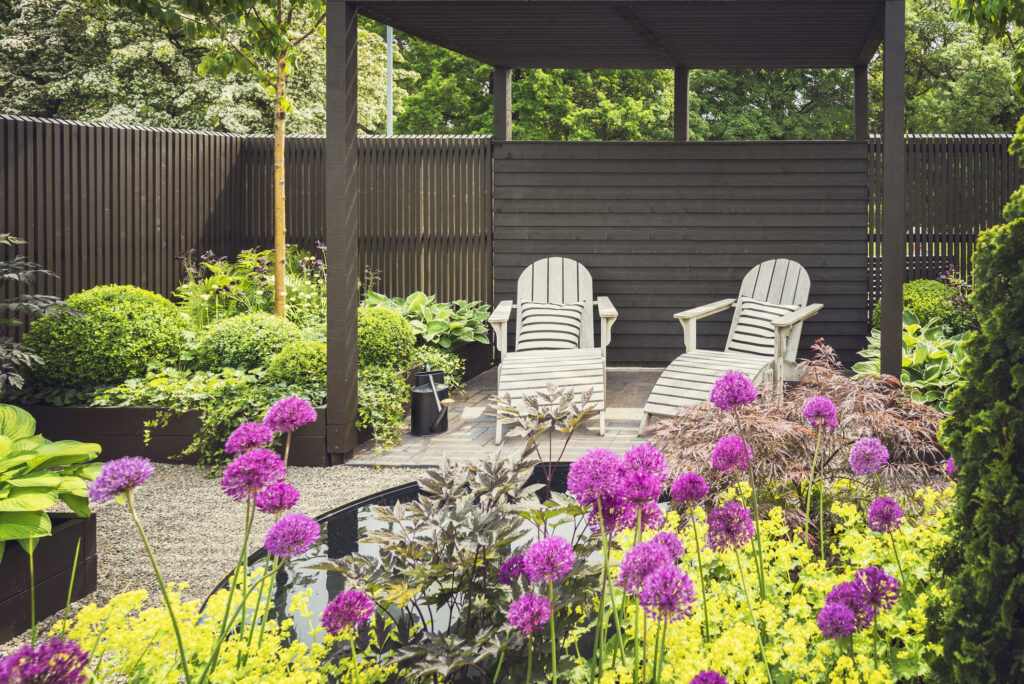 Cozy lounge furniture on landscaped garden terrace